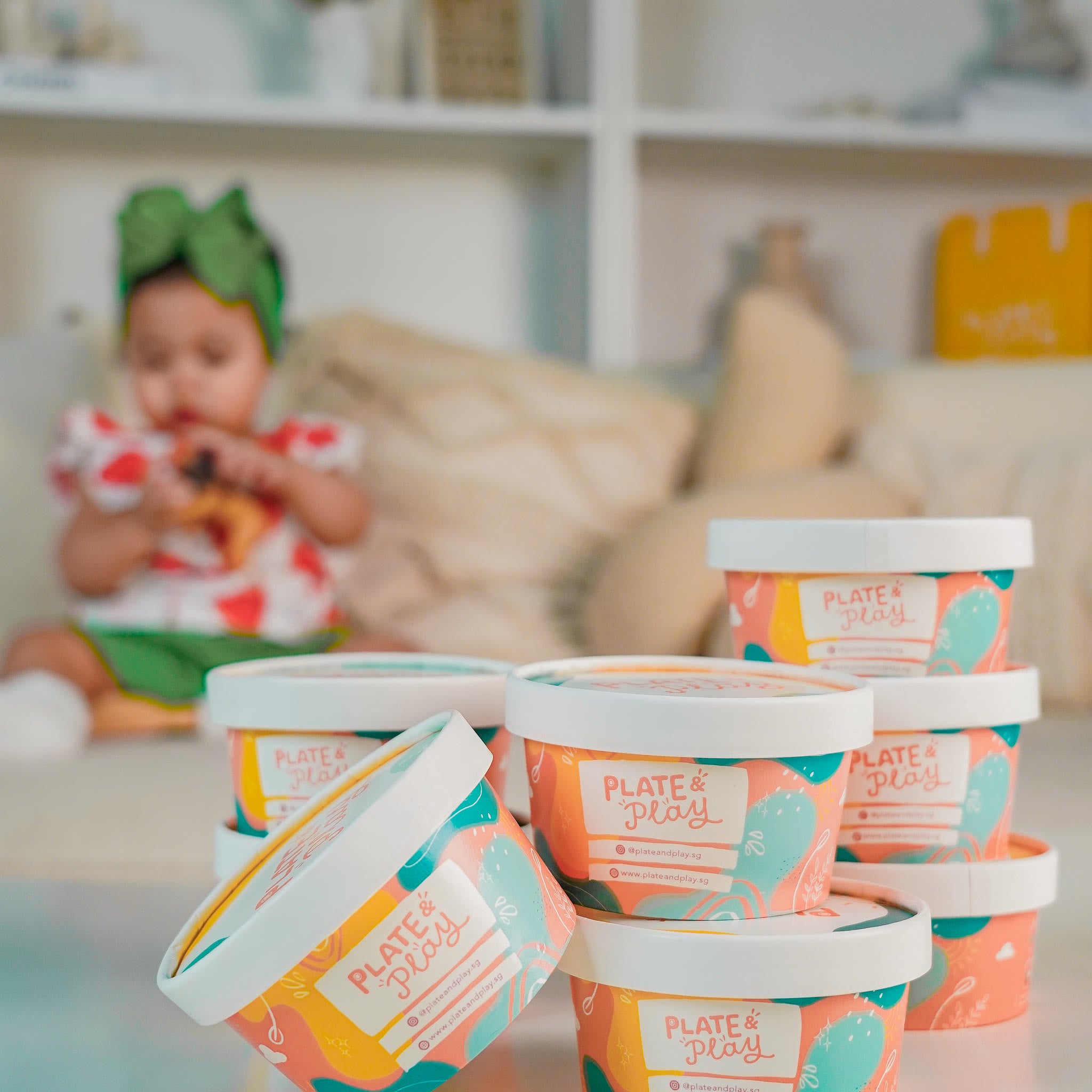 Real Plate and Play tubs with a baby in the background